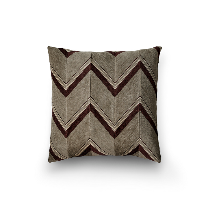 Decorative pillow with chevron pattern on a white background