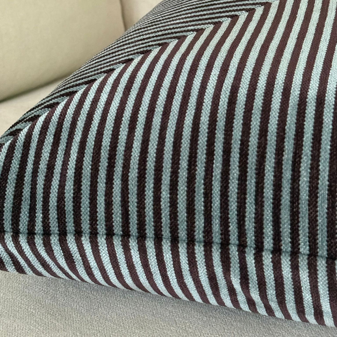 Striped cushion on a beige sofa